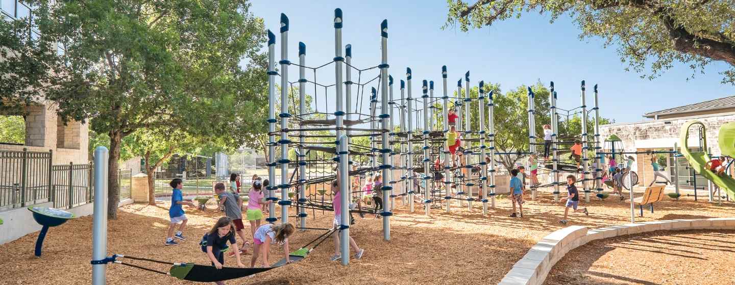 Netclimber playground with dozens of children playing and climbing