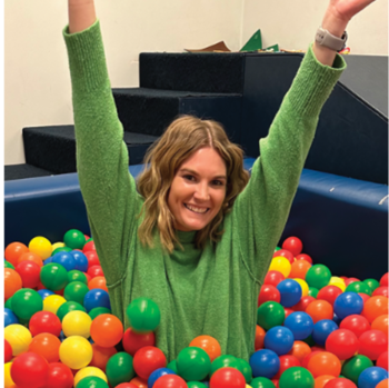 Ariel Mansholt, Inclusive Play specialist at Landscape Structures in a ball pit