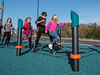 Children climbing on cable net playground fitness feature
