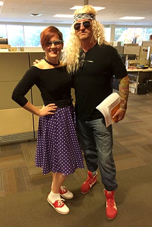 Two Landscape Structures employees pose for the camera in the office cubicles dressing their Halloween costumes.