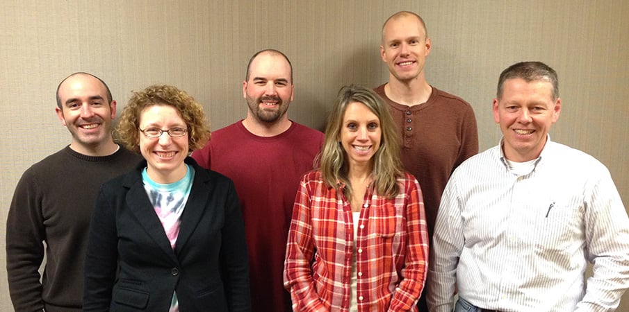 Landscape Structures custom process flow team pose for a group photo.