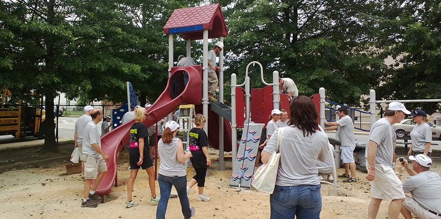 Volunteers building a playground.