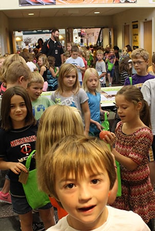 Children standing in a hallway.